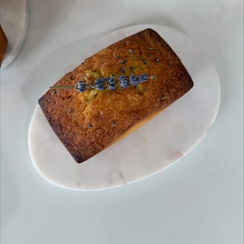 Honey Lavender Garden mini loaf cake topped with lavender, served on a white plate for the Base & Bloom Garden Party Mini Loaves guide.