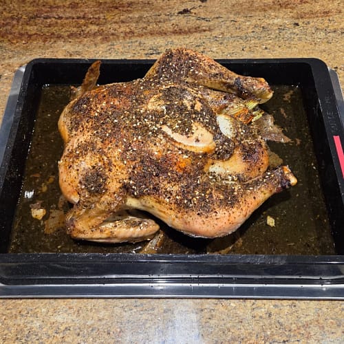 Roasted chicken seasoned with herbs and spices in a bon COOK roasting tray for the May 26 Taste the Trend class.