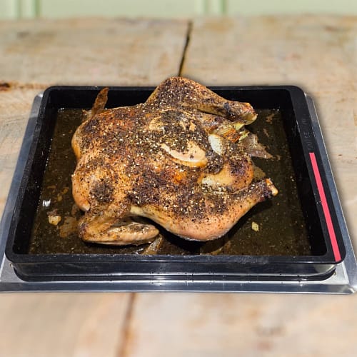 Roasted chicken seasoned with herbs and spices in a bon COOK roasting tray for the May 26 Taste the Trend class.