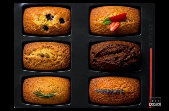 Six Base & Bloom Garden Party Mini Loaves baked in a 6-Loaf Tray with blueberry, strawberry basil, pistachio, chocolate, rosemary, and lavender-inspired toppings.
