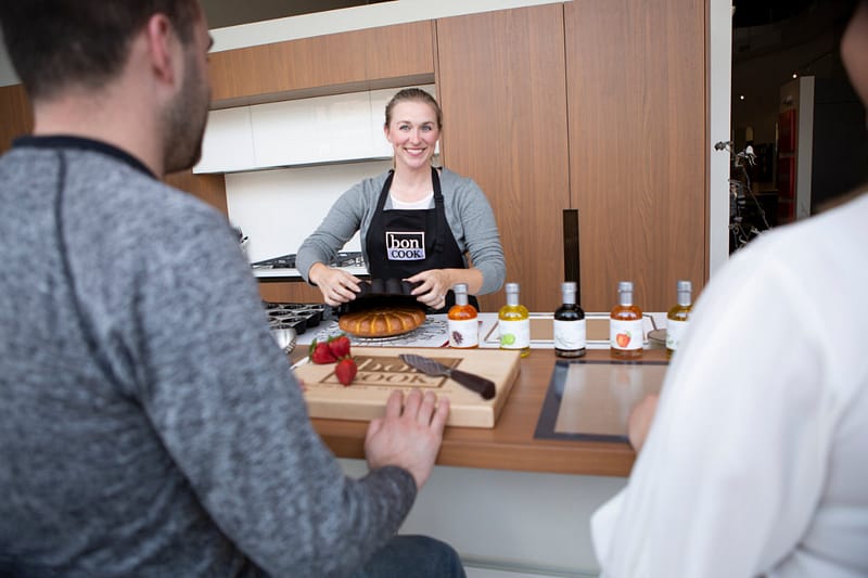 bon COOK instructor leading a hands-on cooking class featuring infused oils and silicone bakeware